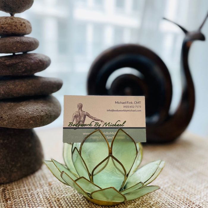 Stacked stones, snail sculpture, lotus flower